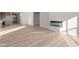 Open living space with hardwood floors and a fireplace at 5021 Carmine St, Brownsburg, IN 46112