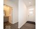 Bright entryway featuring stylish flooring, leading to a bathroom with a modern vanity at 245 Lar Lan Dr, Danville, IN 46122