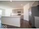 Stylish kitchen with stainless appliances, a center island, and ample counter space, perfect for cooking and entertaining at 245 Lar Lan Dr, Danville, IN 46122