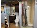 Basement bathroom featuring a pedestal sink, toilet, and shower with a decorative curtain at 6605 Donnelly Dr, Brownsburg, IN 46112