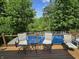 Deck overlooking wooded area, pool and river includes a table and chairs to relax and enjoy the scenic view at 6605 Donnelly Dr, Brownsburg, IN 46112
