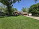 Charming brick home with a well-manicured lawn and mature trees at 6605 Donnelly Dr, Brownsburg, IN 46112