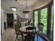 Bright eat-in kitchen features stainless steel refrigerator, a bay window, and a dining table to enjoy meals at 6605 Donnelly Dr, Brownsburg, IN 46112