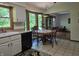Charming eat-in kitchen features a sunny breakfast nook, plenty of windows, and access to additional living spaces at 6605 Donnelly Dr, Brownsburg, IN 46112