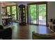 Inviting living room featuring an open floor plan, sliding glass doors to deck, and views of wooded yard at 6605 Donnelly Dr, Brownsburg, IN 46112