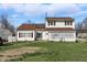 Charming two-story home featuring a covered porch and a well-maintained lawn at 180 N Highland St, Morgantown, IN 46160