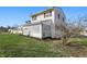 Angle view of charming house with lattice porch and side yard at 180 N Highland St, Morgantown, IN 46160