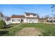 Charming two-story home with red shutters and a well-manicured lawn in a neighborhood setting at 180 N Highland St, Morgantown, IN 46160
