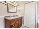 Bathroom featuring wood cabinets, sink, and vanity at 2036 N Talbott St, Indianapolis, IN 46202