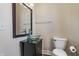 Bathroom with a glass vessel sink, a large mirror, and a modern toilet at 2036 N Talbott St, Indianapolis, IN 46202