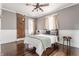 Bedroom with exposed brick, hardwood floors, and a ceiling fan at 2036 N Talbott St, Indianapolis, IN 46202