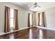 This bedroom features hardwood floors, neutral walls, and multiple windows for natural light at 2036 N Talbott St, Indianapolis, IN 46202
