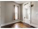 Bright bedroom with hardwood floors, window with natural light, and classic trim details at 2036 N Talbott St, Indianapolis, IN 46202