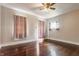 Bedroom featuring hardwood floors and two windows with curtains at 2036 N Talbott St, Indianapolis, IN 46202
