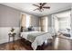 Bedroom with hardwood floors, neutral walls, and view of office at 2036 N Talbott St, Indianapolis, IN 46202