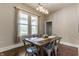 The dining room features a wooden table with seating for six and a modern chandelier at 2036 N Talbott St, Indianapolis, IN 46202
