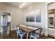 Bright dining room with hardwood floors, modern chandelier, and view to kitchen at 2036 N Talbott St, Indianapolis, IN 46202