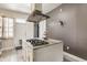 Kitchen with island, granite countertop, gas cooktop, and range hood at 2036 N Talbott St, Indianapolis, IN 46202