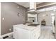 Bright kitchen features a white island with granite countertop and stainless steel appliances at 2036 N Talbott St, Indianapolis, IN 46202