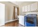 Functional laundry room with washer, dryer, sink, and storage cabinets at 2036 N Talbott St, Indianapolis, IN 46202
