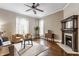 Cozy living room with hardwood floors, neutral tones, fireplace, and ample natural light at 2036 N Talbott St, Indianapolis, IN 46202