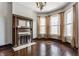 Living room with a decorative fireplace and bay windows for natural light at 2036 N Talbott St, Indianapolis, IN 46202