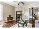 Bright living room features a fireplace with dark trim, hardwood floors, and access to other spaces at 2036 N Talbott St, Indianapolis, IN 46202