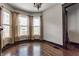 Bright living room featuring beautiful hardwood floors and multiple windows for lots of light at 2036 N Talbott St, Indianapolis, IN 46202