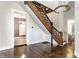 Beautiful staircase with decorative wood trim, hardwood floors, and chandelier, creating an elegant focal point at 2036 N Talbott St, Indianapolis, IN 46202