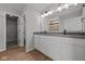 Bathroom with double vanity, wood look flooring and access to walk-in closet at 4180 Bozeman Way, Bargersville, IN 46106