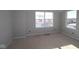 Bright bedroom featuring two large windows and light grey walls at 4180 Bozeman Way, Bargersville, IN 46106