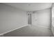 Bright bedroom features neutral walls, plush carpet, and a view of the home's interior at 4180 Bozeman Way, Bargersville, IN 46106