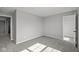 View of a bedroom with neutral walls and carpet, complemented by natural light from the window at 4180 Bozeman Way, Bargersville, IN 46106