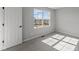 Bright bedroom featuring neutral walls, plush carpet, and a window offering natural light at 4180 Bozeman Way, Bargersville, IN 46106