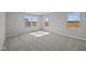 Bedroom with carpet, multiple windows, and access to another room at 4180 Bozeman Way, Bargersville, IN 46106