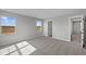 A bedroom with carpet, gray walls, and bright natural light at 4180 Bozeman Way, Bargersville, IN 46106