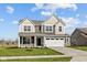Charming two-story home with gray siding, white trim, and a well-kept lawn with a large two car garage at 4180 Bozeman Way, Bargersville, IN 46106
