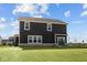 The back of a house with sod and a brick foundation at 4180 Bozeman Way, Bargersville, IN 46106