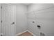 Practical laundry room with storage shelf and hookups at 4180 Bozeman Way, Bargersville, IN 46106