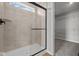 A tiled shower with glass door and a window at 4180 Bozeman Way, Bargersville, IN 46106