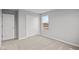 Bedroom featuring neutral carpet, grey walls, a window, and a closet with sliding doors at 4186 Dutton Dr, Bargersville, IN 46106