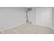 Bedroom features neutral carpet, grey walls, closet space, and entryways leading to other rooms at 4186 Dutton Dr, Bargersville, IN 46106