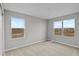 Bedroom with neutral carpet, two windows offering beautiful views, and neutral grey walls at 4186 Dutton Dr, Bargersville, IN 46106