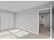Bedroom showcasing neutral carpet, grey walls, an exterior door, and a double-door closet at 4186 Dutton Dr, Bargersville, IN 46106
