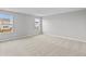 Light-filled bedroom with neutral carpet, grey walls, and scenic views from the double windows at 4186 Dutton Dr, Bargersville, IN 46106