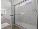 Bathroom featuring a glass-enclosed shower with marble-style tiling and modern fixtures at 4193 Bozeman Way, Bargersville, IN 46106