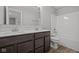 Bathroom featuring wood-look floors, a double vanity, toilet and tub-shower combo at 4193 Bozeman Way, Bargersville, IN 46106