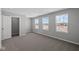 Bedroom bathed in natural light with large windows showcasing an outside view and an open doorway at 4193 Bozeman Way, Bargersville, IN 46106