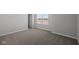 Neutrally decorated bedroom with carpet, a window, and a door to a closet at 4193 Bozeman Way, Bargersville, IN 46106