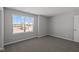 Cozy bedroom with neutral walls, carpet, and a large window offering neighborhood views at 4193 Bozeman Way, Bargersville, IN 46106